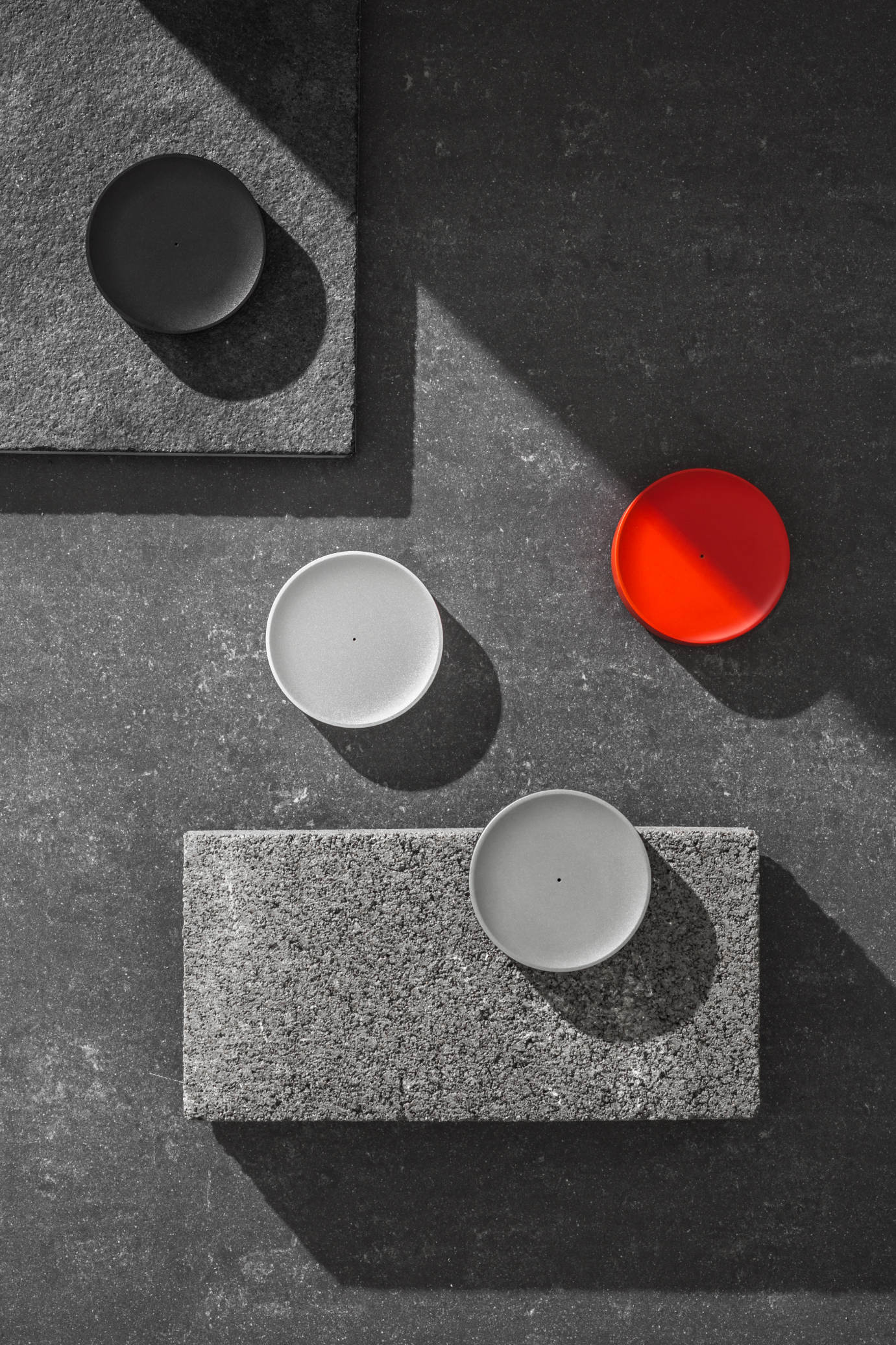 Tiller devices in multiple colours on slate surface